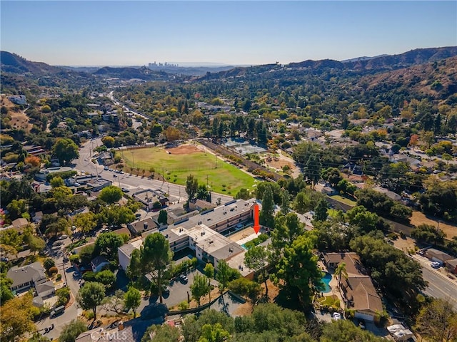 birds eye view of property featuring a mountain view