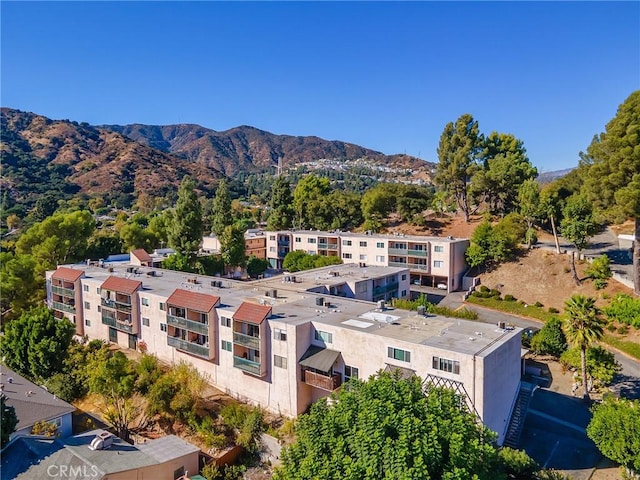 birds eye view of property with a mountain view