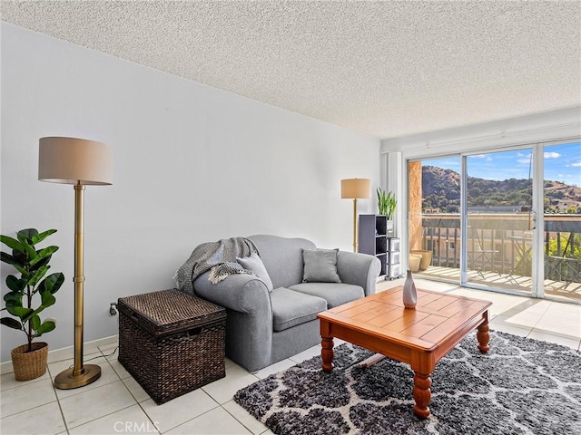 tiled living room with a textured ceiling