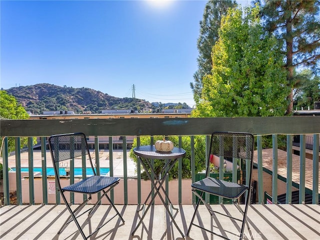 balcony featuring a mountain view