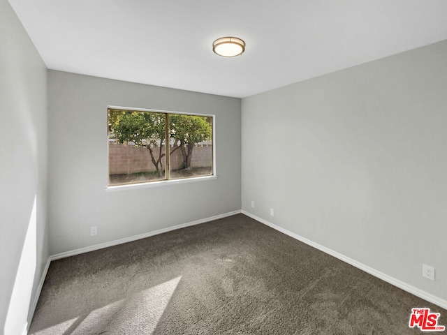 empty room featuring carpet flooring