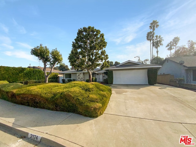 ranch-style house featuring a garage