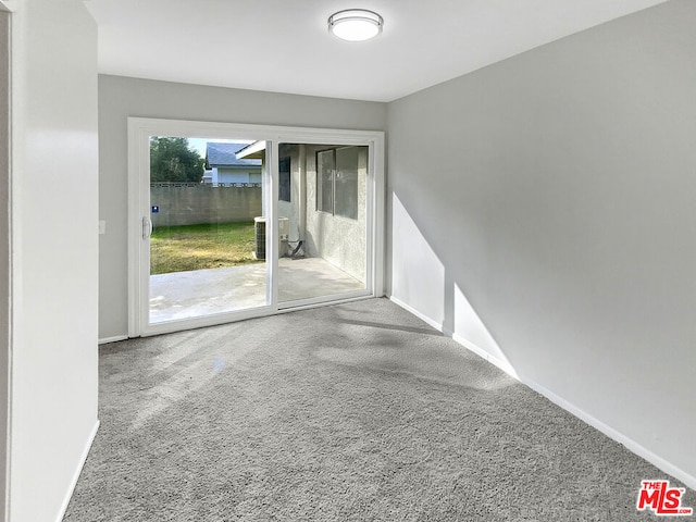 unfurnished room with carpet flooring