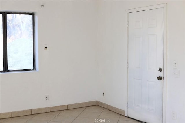 empty room with light tile patterned floors