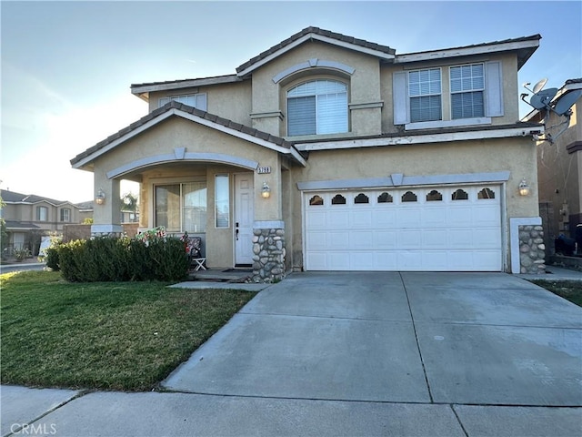 front facade with a garage and a front yard