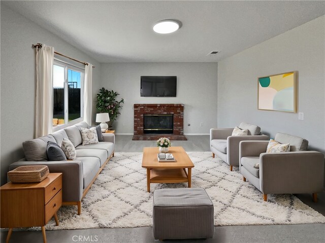 carpeted living room with a fireplace