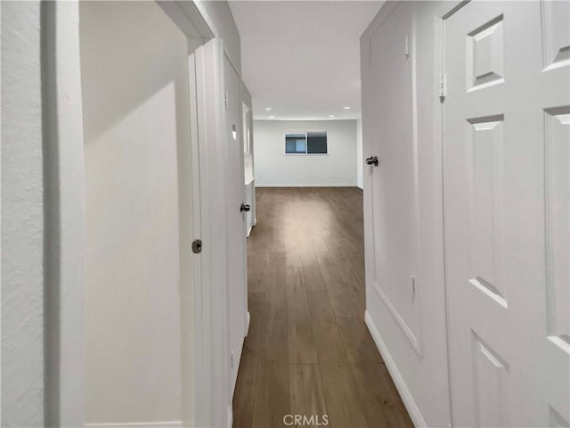 corridor featuring dark wood-type flooring