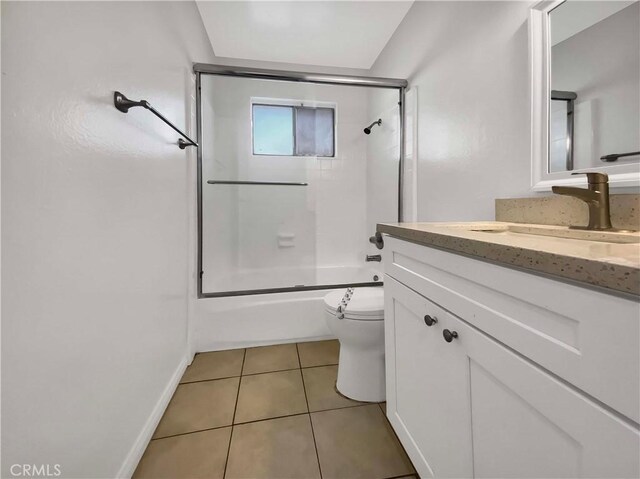 full bathroom with vanity, tile patterned floors, shower / bath combination with glass door, and toilet