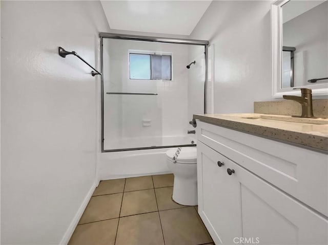 full bath featuring vanity, bath / shower combo with glass door, tile patterned floors, and toilet