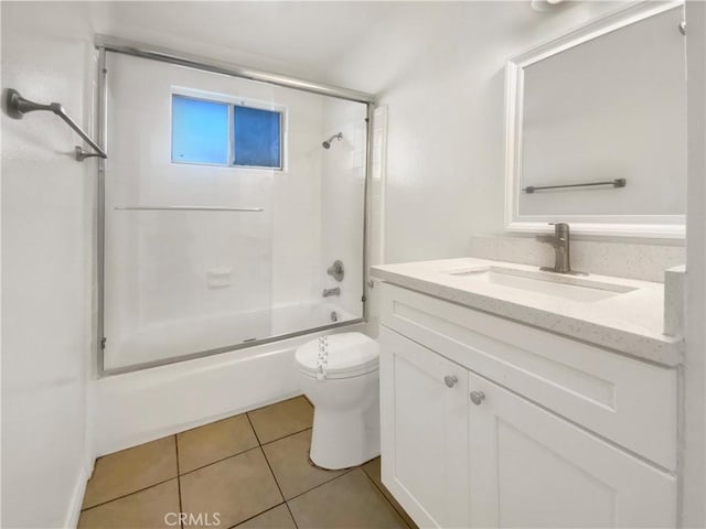 bathroom with toilet, tile patterned floors, washtub / shower combination, and vanity