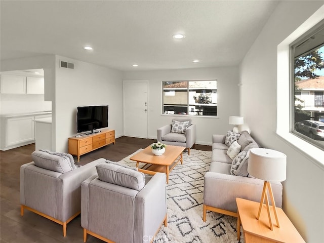 living room featuring recessed lighting and visible vents