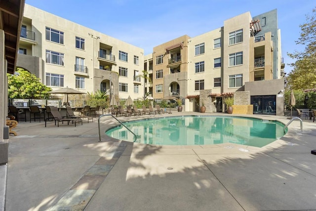 view of pool featuring a patio area