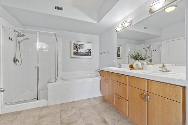 bathroom featuring vanity and plus walk in shower