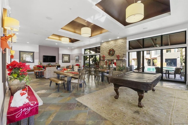 rec room with a tray ceiling and billiards