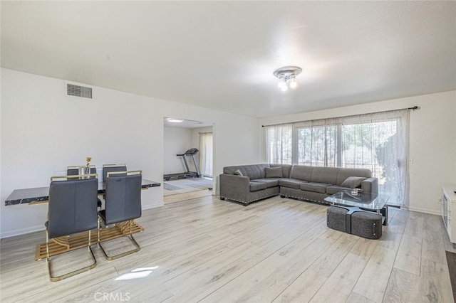 living room with light hardwood / wood-style floors