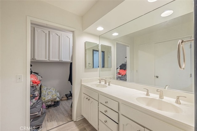 bathroom featuring hardwood / wood-style floors and vanity