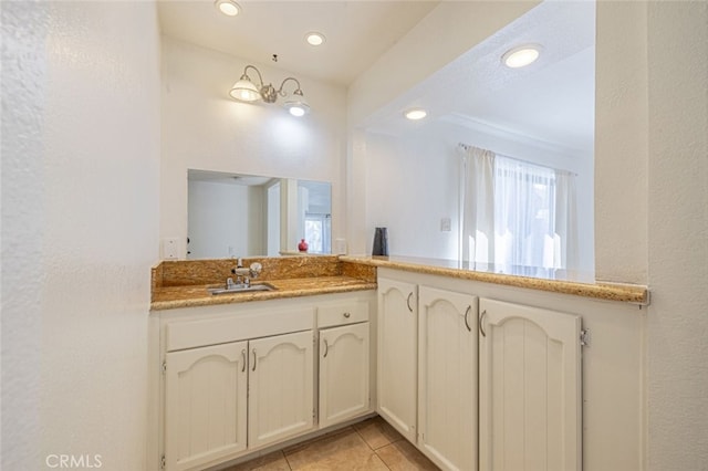 bathroom with vanity and tile patterned flooring