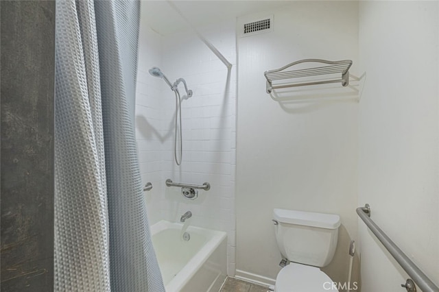 bathroom with toilet and shower / tub combo