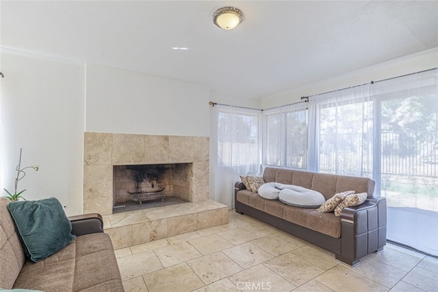 living room featuring a tile fireplace