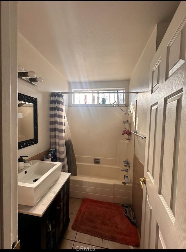 bathroom with tile patterned flooring, vanity, and shower / bath combination with curtain