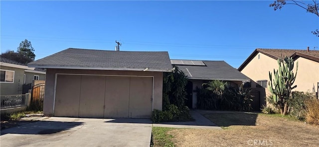 view of front of property featuring solar panels