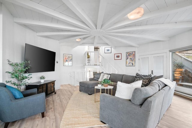 living room with beam ceiling and light wood-type flooring