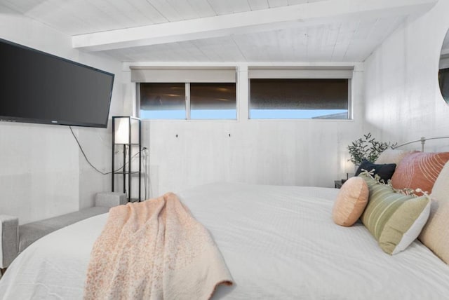 bedroom featuring beamed ceiling