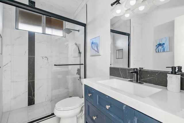 bathroom with an enclosed shower, vanity, and toilet