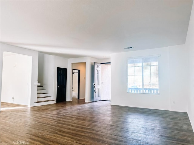 empty room with dark hardwood / wood-style floors