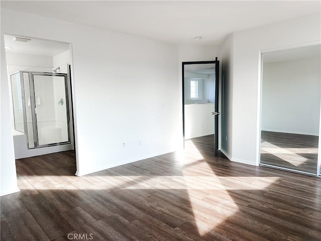 unfurnished room with hardwood / wood-style floors