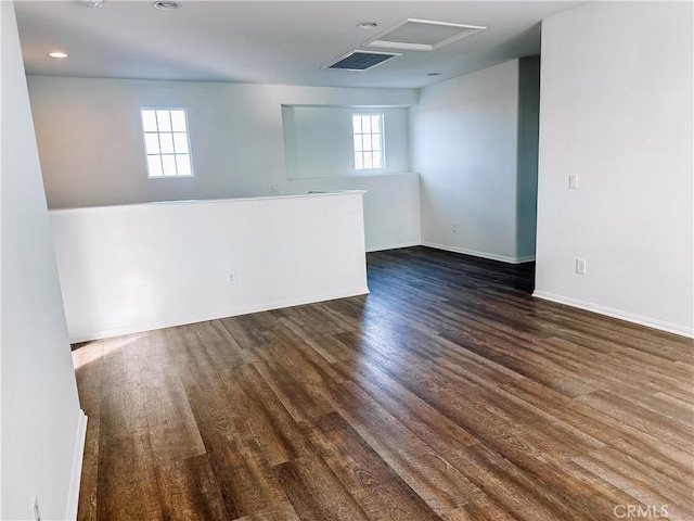 spare room featuring dark wood-type flooring