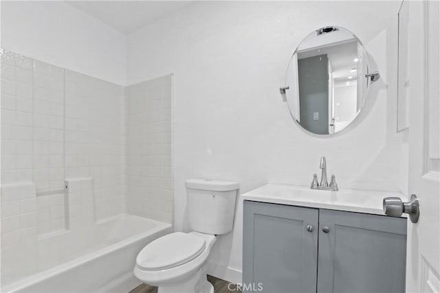 full bathroom featuring toilet, vanity, and  shower combination