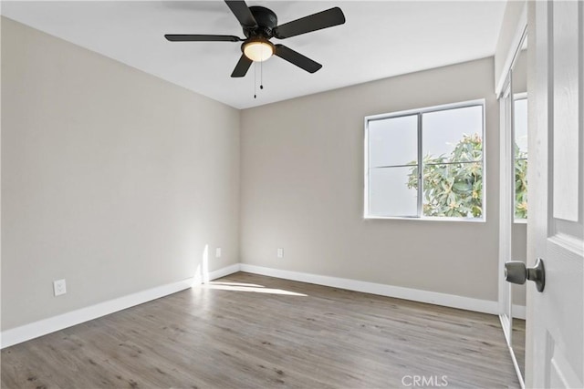 unfurnished room featuring ceiling fan and light hardwood / wood-style flooring