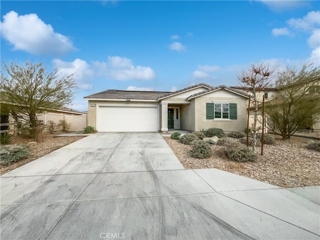 ranch-style house featuring a garage, driveway, a tiled roof, and stucco siding