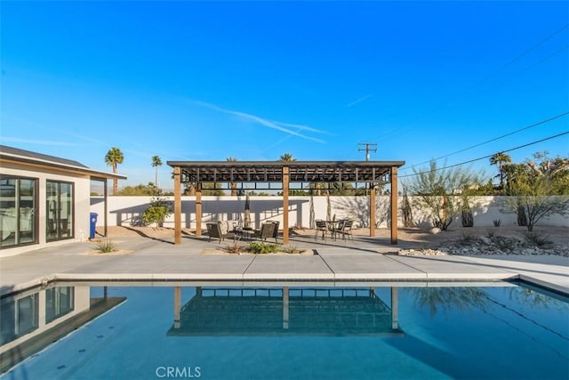 view of pool with a pergola and a patio area