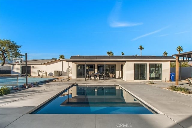 rear view of property featuring a patio area