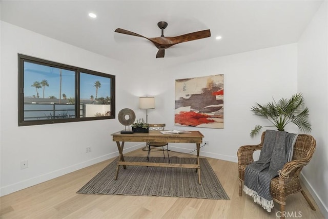 office featuring ceiling fan and light wood-type flooring