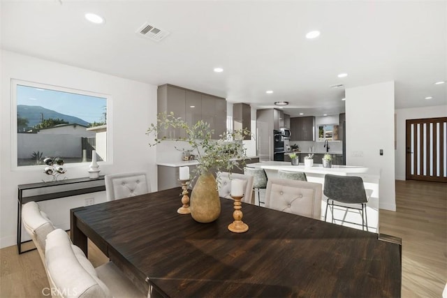 dining room with light hardwood / wood-style flooring