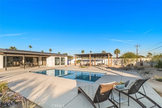 view of swimming pool featuring a pergola and a patio area