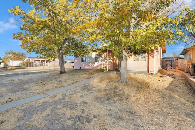 view of property hidden behind natural elements