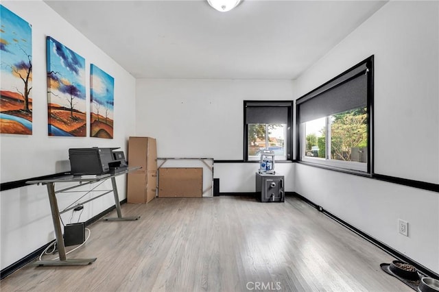 office area with light hardwood / wood-style flooring