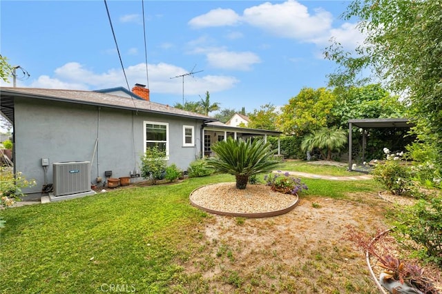 view of yard with central AC