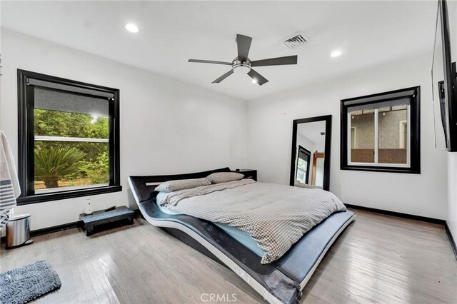 bedroom featuring ceiling fan and wood-type flooring