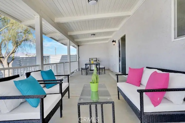 sunroom / solarium with beamed ceiling