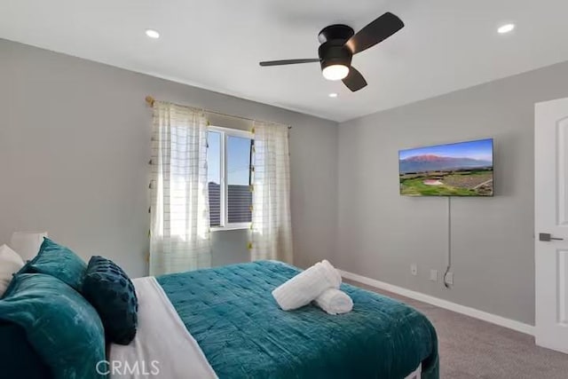 bedroom with ceiling fan and carpet