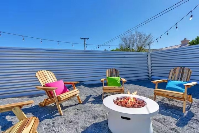 view of patio with a fire pit