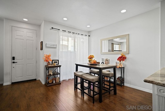 dining area featuring dark hardwood / wood-style floors