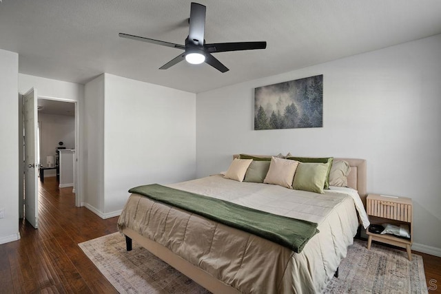 bedroom featuring ceiling fan and dark hardwood / wood-style flooring