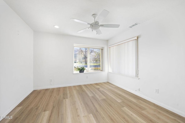 empty room featuring ceiling fan and light wood-type flooring