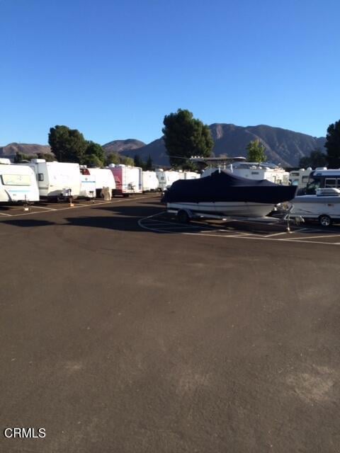 view of parking / parking lot featuring a mountain view